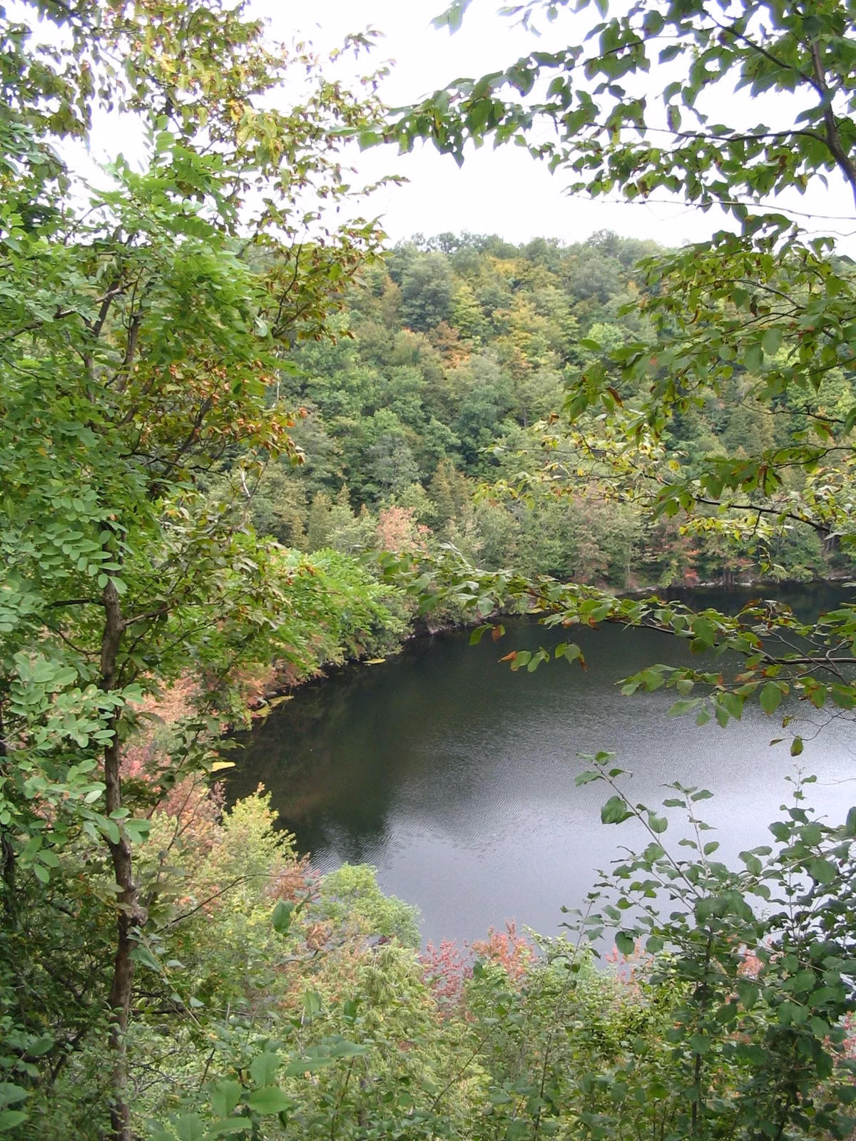 The glacial lake at Clark Reservation seen from the wooded rim above